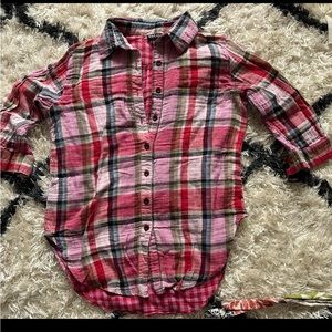It’s from wet seal and is a pink plaid button up shirt in a size medium
